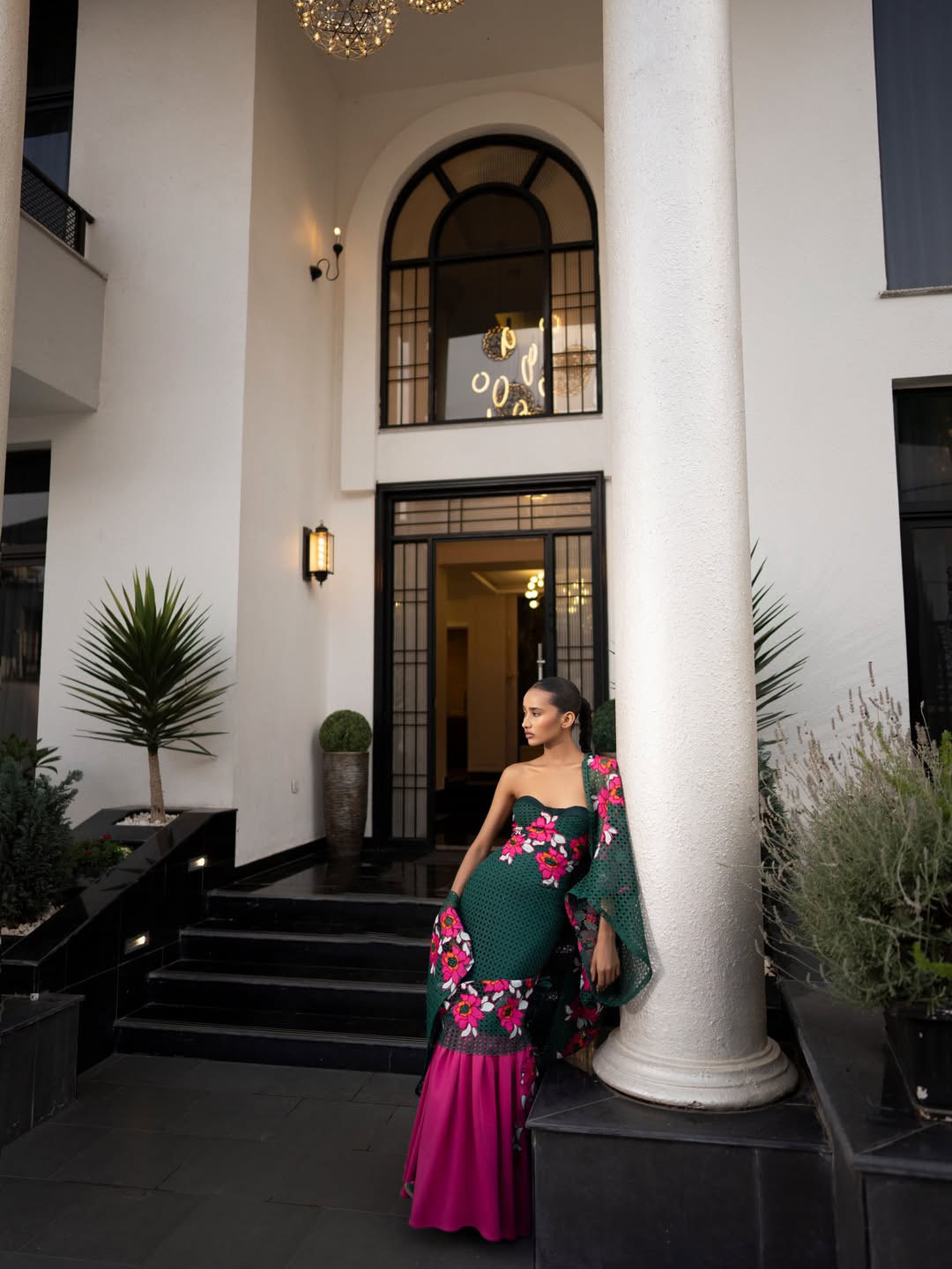 Close editorial portrait of the Emerald Reverie gown with floral detailing